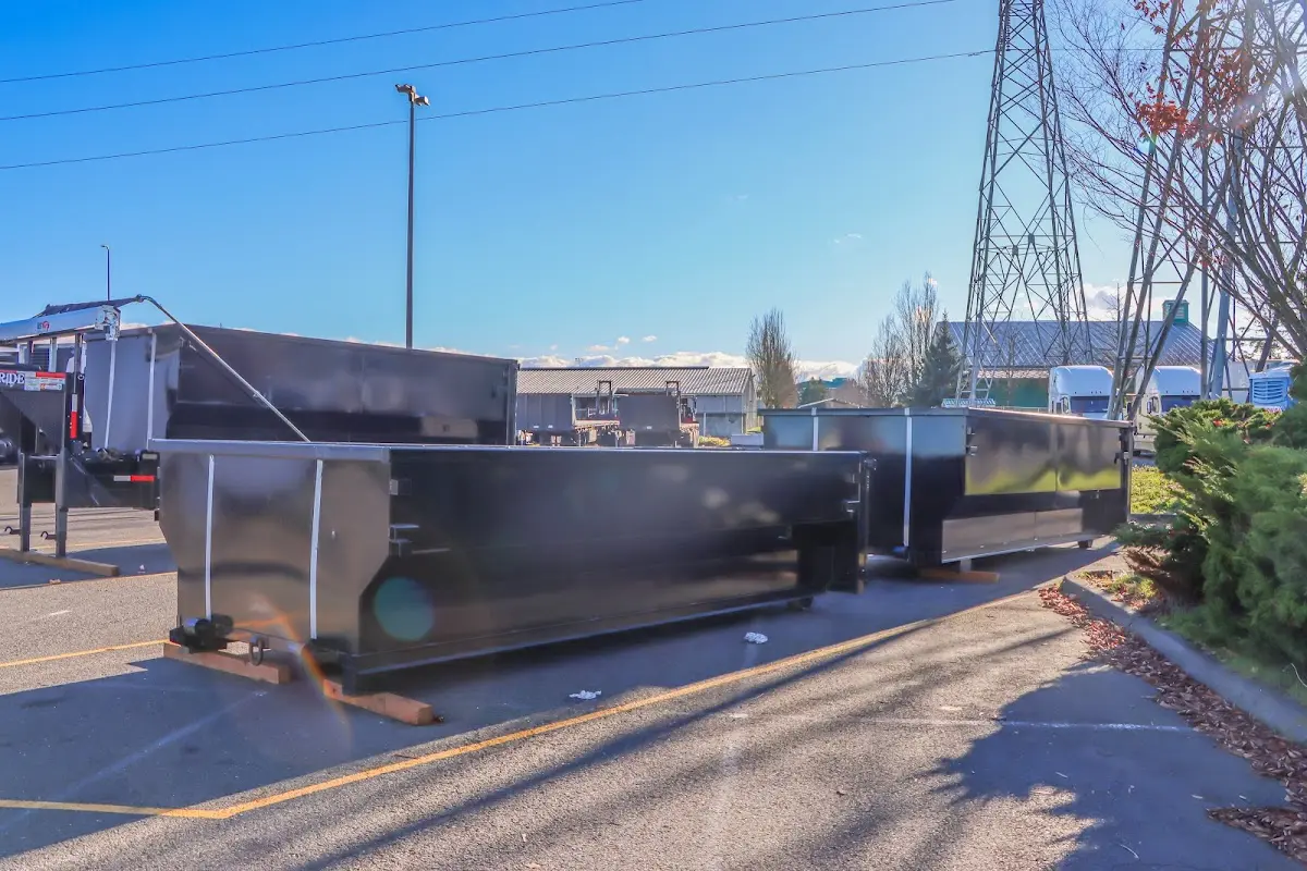 Roll-off dumpster ready for waste disposal at job site for Concrete Dumpster Rental in Antrim